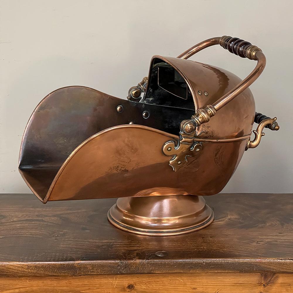 19th century copper coal scuttle with scoop is an exceptional artifact from a bygone era, when handmade items were the rule, not the exception! Crafted by a talented metalsmith from solid copper, it features a shape good for both coal or kindling,