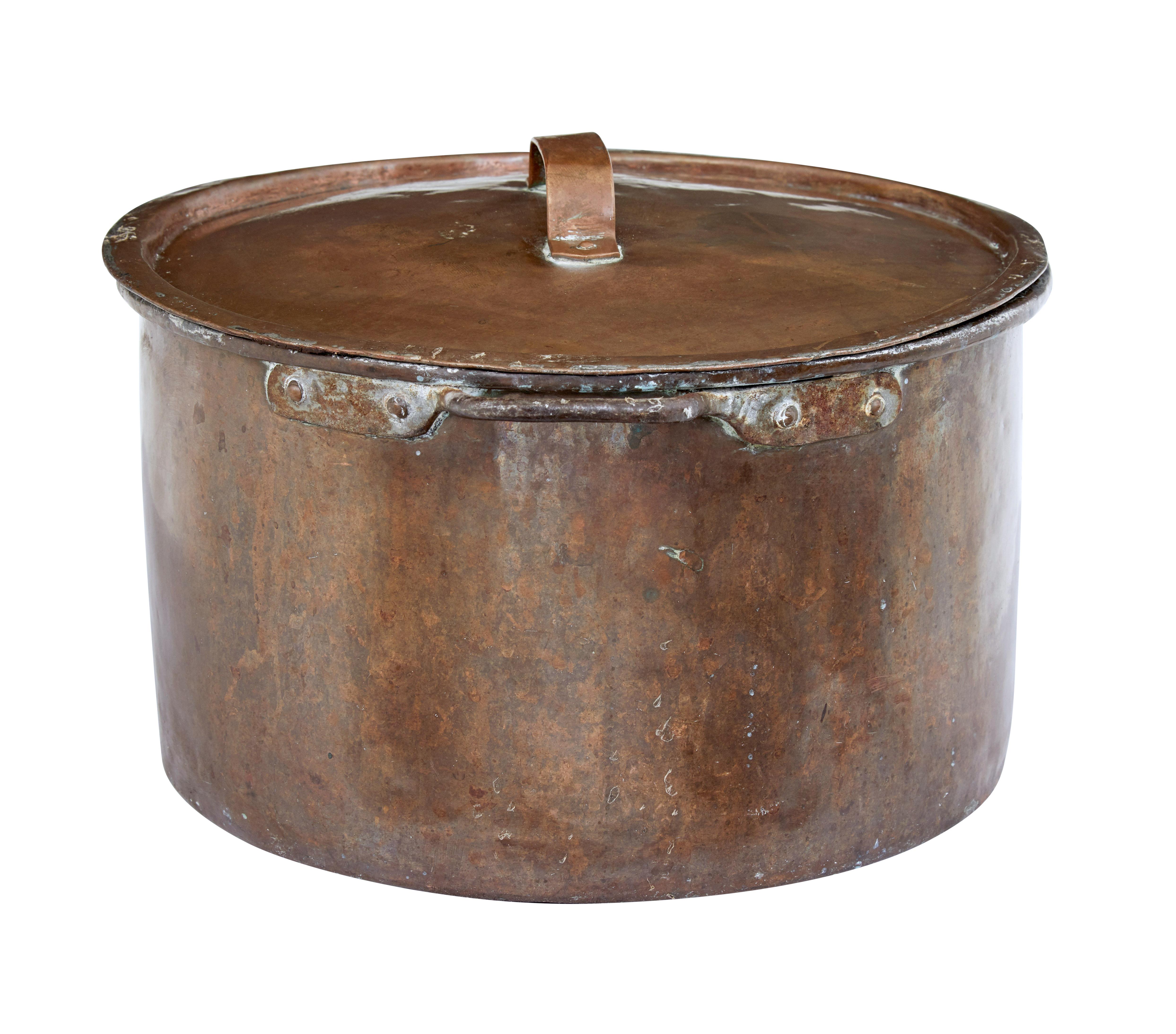 19th century copper cooking pot with lid, circa 1880.

Good quality cooking pot complete with original lid. Fitted with handles. Ideal for use as a log basket or kitchenalia display.

Expected surface marks and wear.