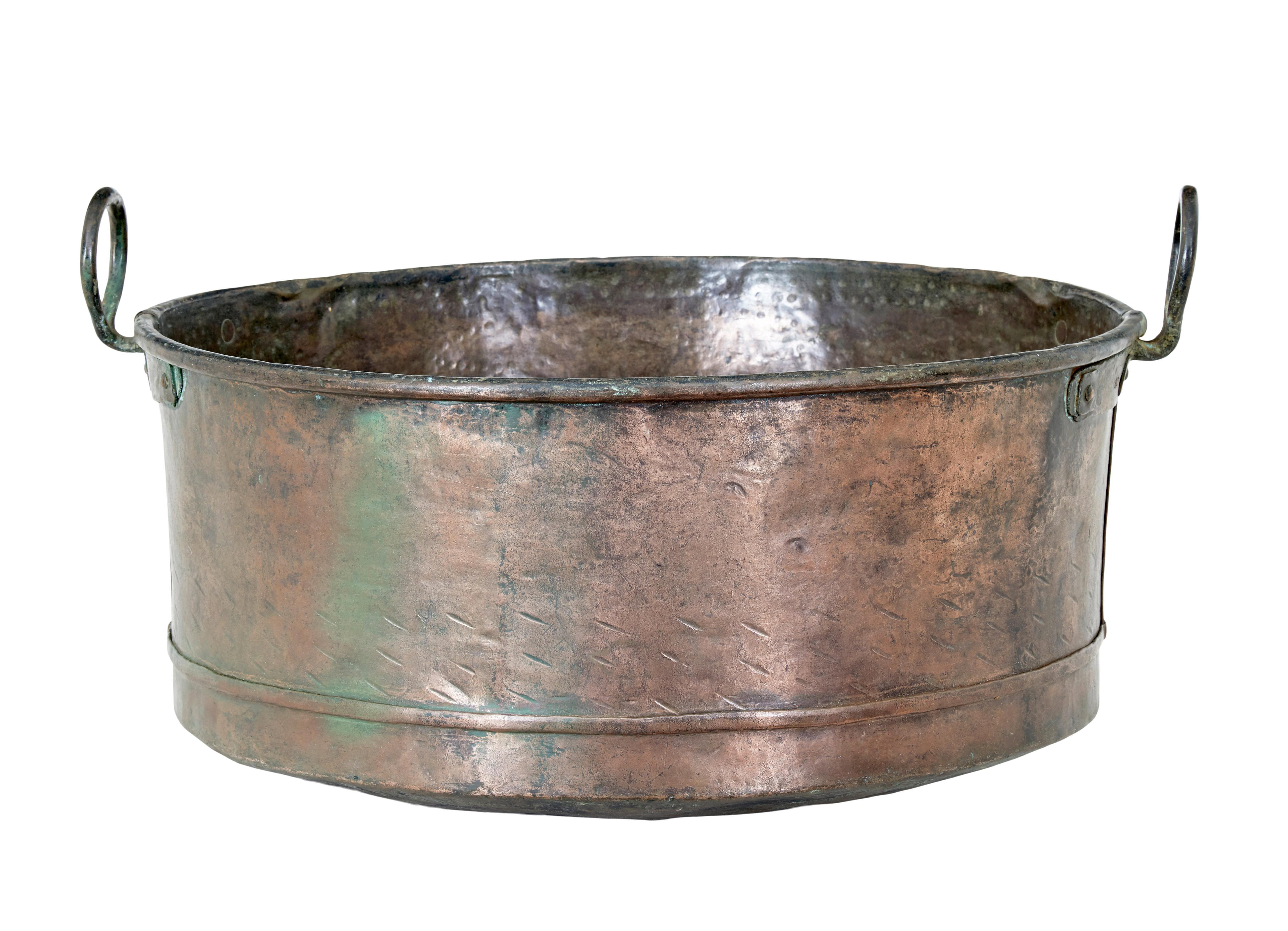 19th century copper cooking vessel circa 1880.

Beautiful quality copper large cooking pot.  A fine example of hand crafted metalwork with its seams, handles and decoration.

Fine piece of decoration or would make an ideal fireside log
