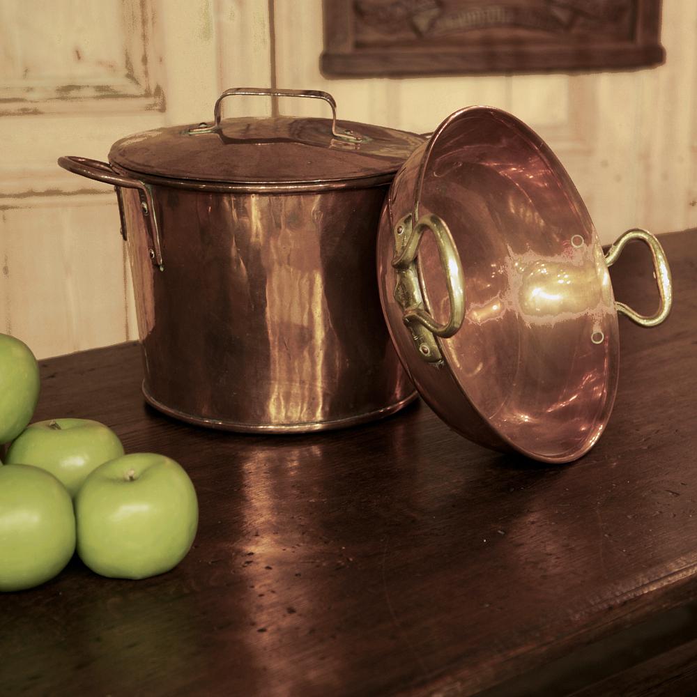 19th century copper stock pot with lid was completely crafted by hand, and is an example of the Old World philosophy of building things to last! The copper body was wrapped around and secured with a soldered dovetail joint the entire seam, with