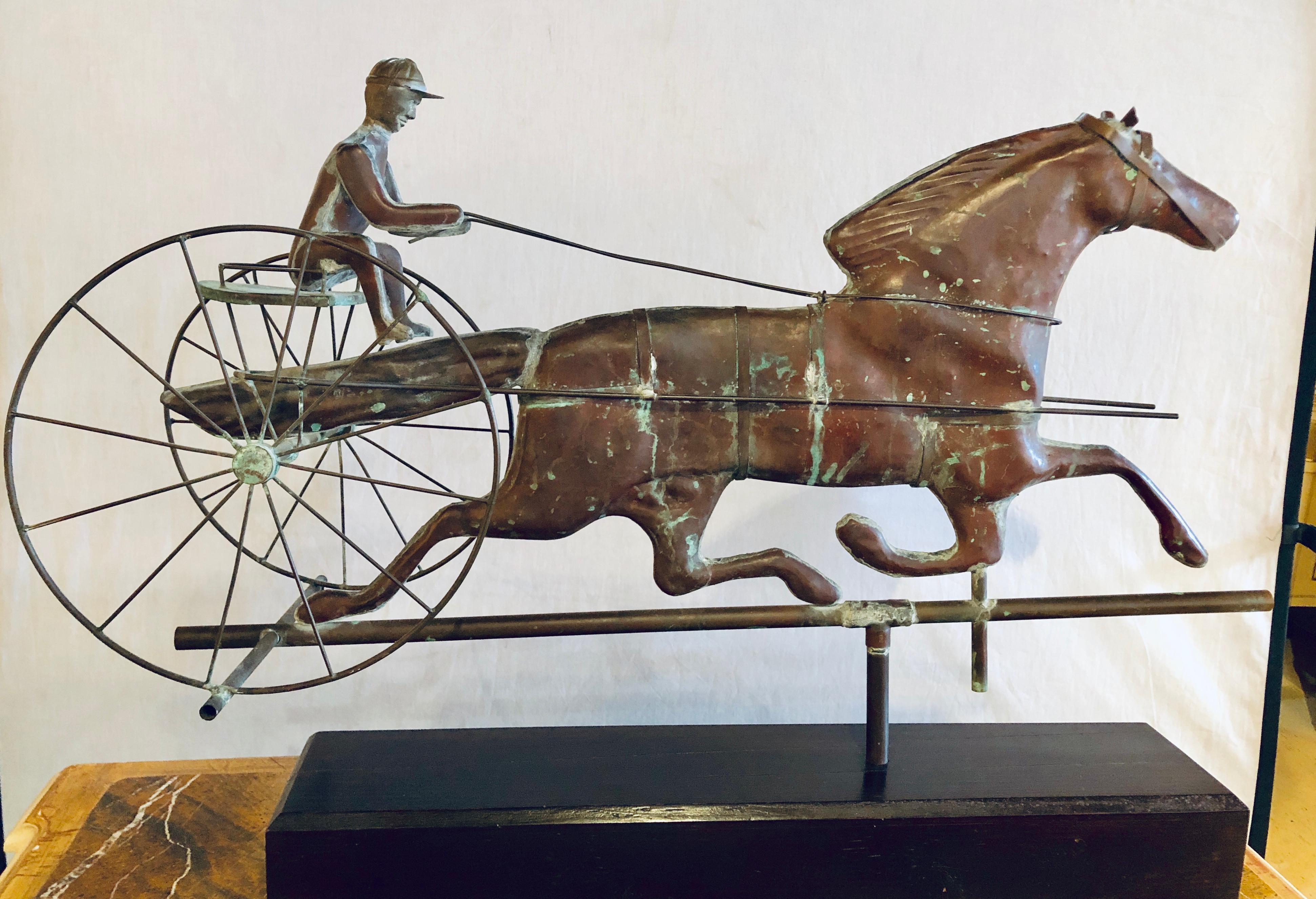 St. Julien with Sulky Molded Copper Weather Vane, attributed to J.W. Fiske, New York, last quarter 19th century, full-bodied molded sheet copper horse and driver vane with cast iron horse's head and driver's hands, sheet copper reins and seat,