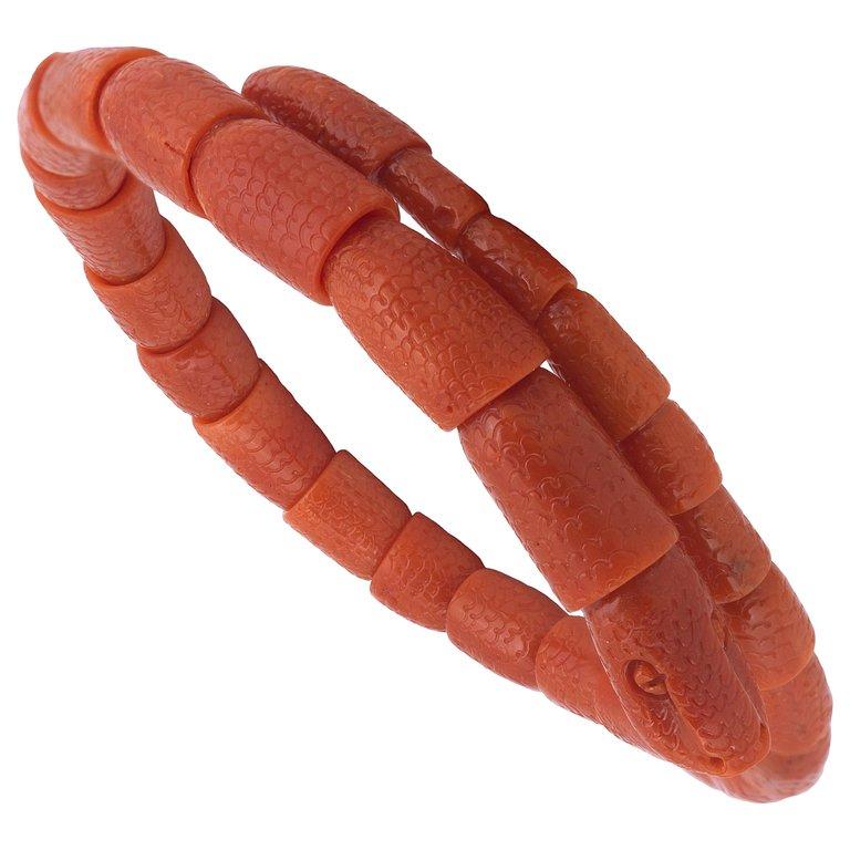 BERNARDO ANTICHITÀ PONTE VECCHIO FLORENCE
The sprung coiled body of carved coral corallium rubrum links, terminating in a carved snake's head,length adjustable
