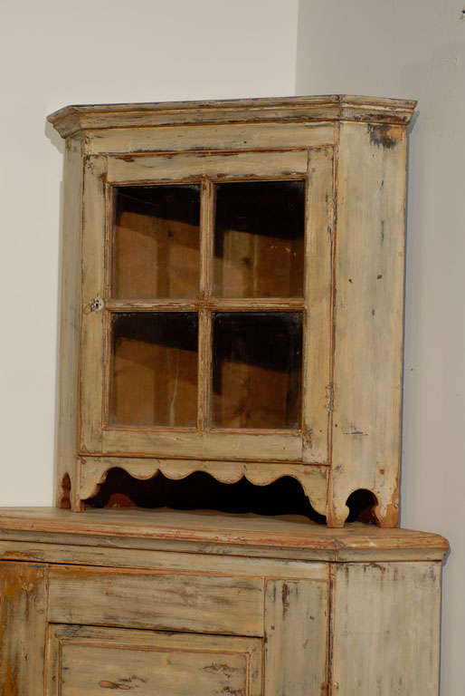 Early 19th century painted corner cupboard, French. This item is one of a kind.