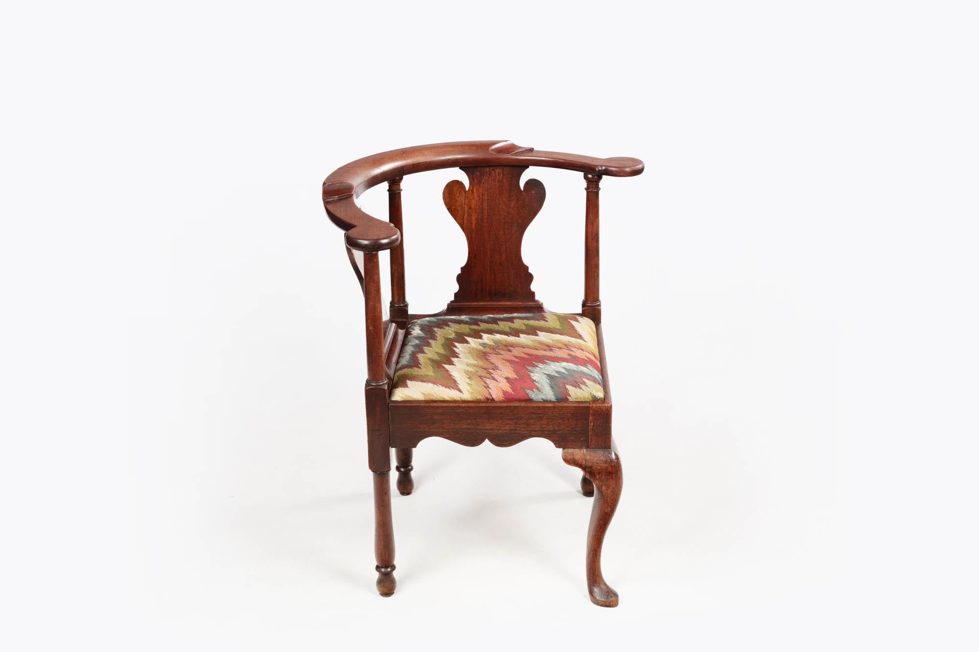 19th Century mahogany corner chair with urn back slats, upholstered seat, three-pillar legs & cabriole leg with pad foot to the front.