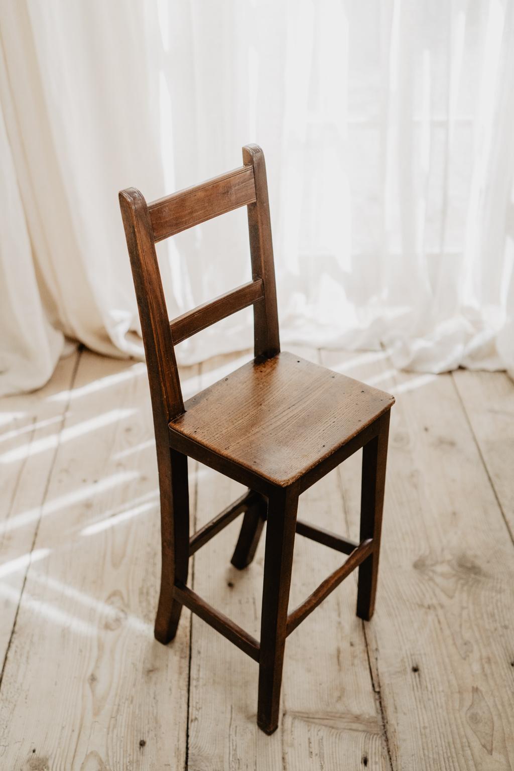 A lovely and quirky elm and fruitwood correction chair, used to teach straight up sitting during the 19th century in English schools.