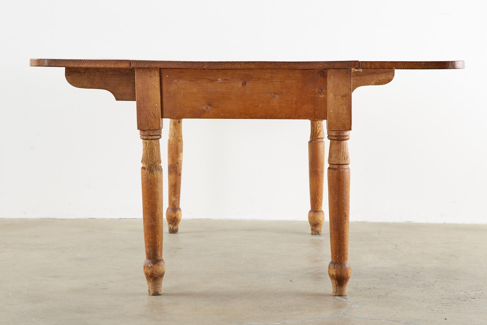 Hand-Crafted 19th Century Country English Drop-Leaf Pine Farmhouse Dining Table For Sale