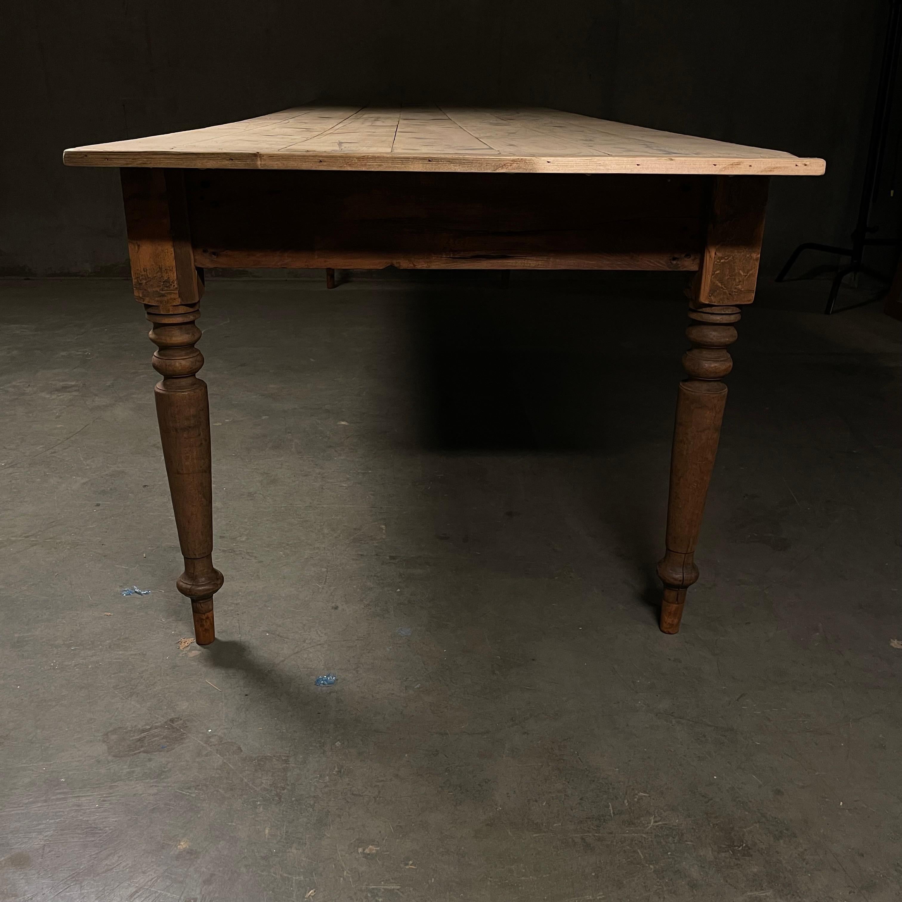 An original pine farm table in full 10 ft lenght good height 24 “ from skirt to floor , dry finish , solid and shows nice patina .
Found in Iowa. 

Shipping available … custom finish also available.   