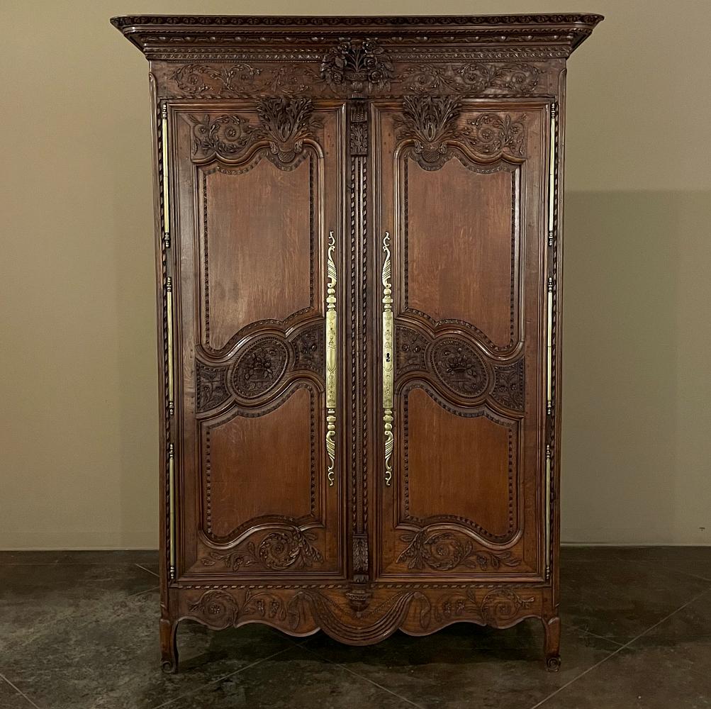 19th century Country French armoire from Normandie is a classic example of the incredible craftsmanship developed in the region over the course of many centuries! Dense, old-growth oak was selected for its longevity, and the rectilinear casework was
