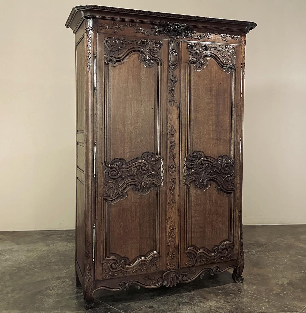 19th Century Country French Armoire from Normandie is a sterling example of the master craftsmanship from the provinces of France, where talented artisans utilized time-honored techniques and skills handed down through the generations to produce