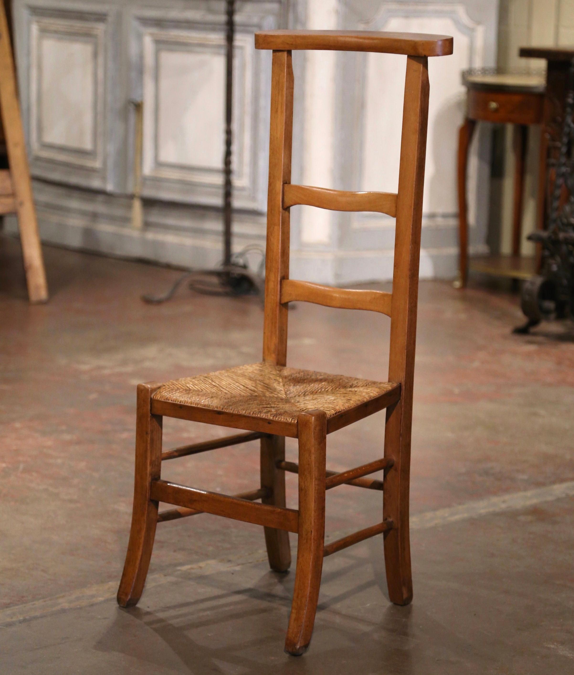 Place this elegant antique prayer chair in a bedroom for your daily devotions. Created in Normandy, France circa 1880, the Prie-Dieu ( Pray God ), stands on curved legs joined by a double turned stretcher over a hand woven rush seat. The tall back