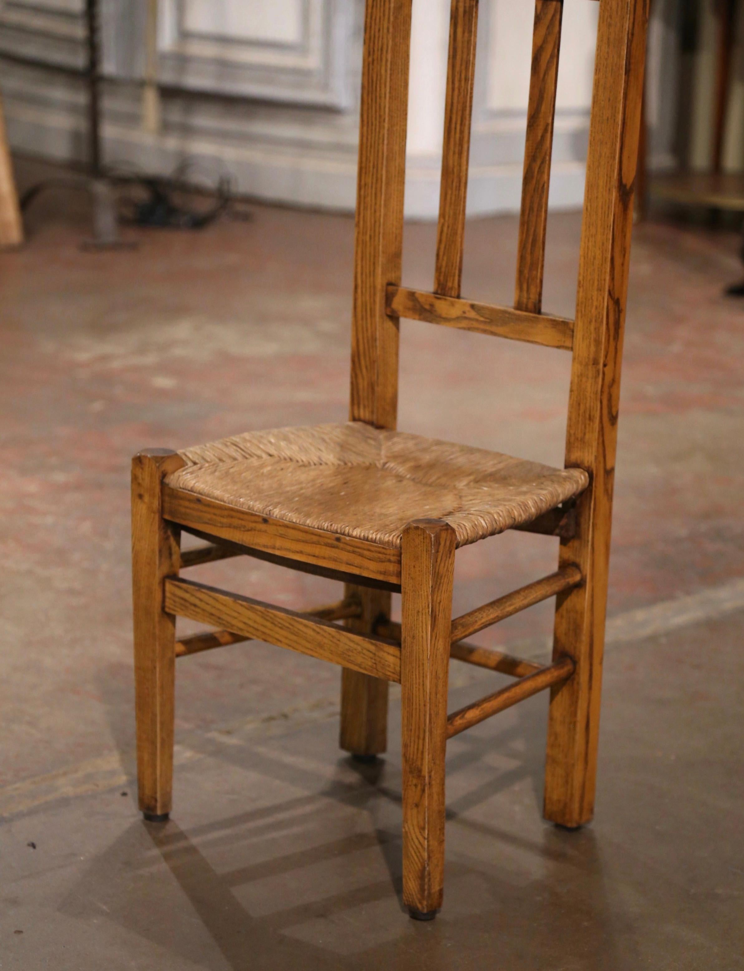 Place this elegant antique prayer chair in a bedroom for your daily devotions. Created in Normandy, France circa 1880, the Prie-Dieu ( Pray God ), stands on curved legs joined by a double turned stretcher over a hand woven rush seat. The tall back