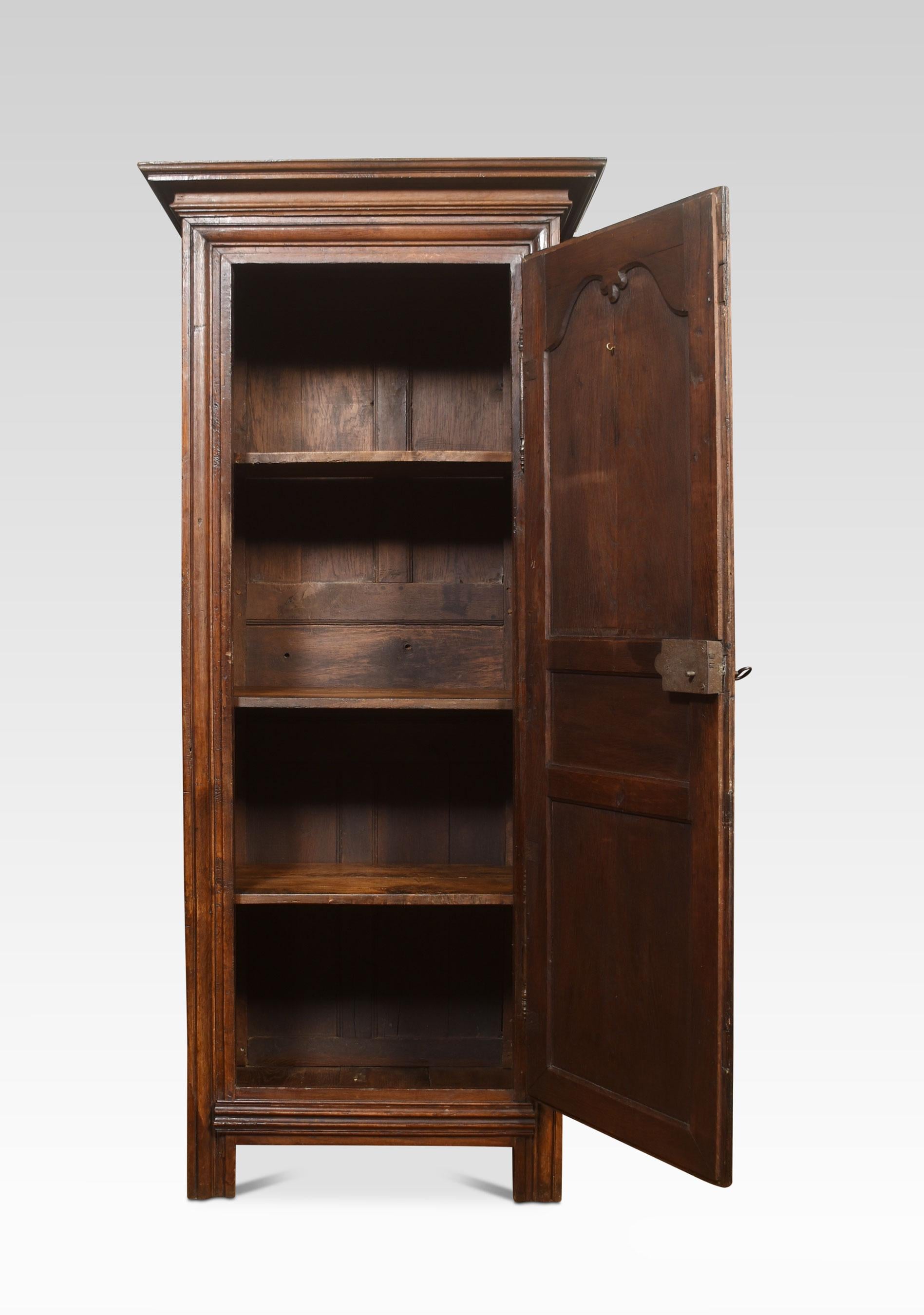 19th century Country French bonnetiere petite armoire with stepped pediment above large carved scrolling panel door enclosing shelved interior All raised up on block supports.
Dimensions
Height 88.5 Inches
Width 38.5 Inches
Depth 22.5 Inches.