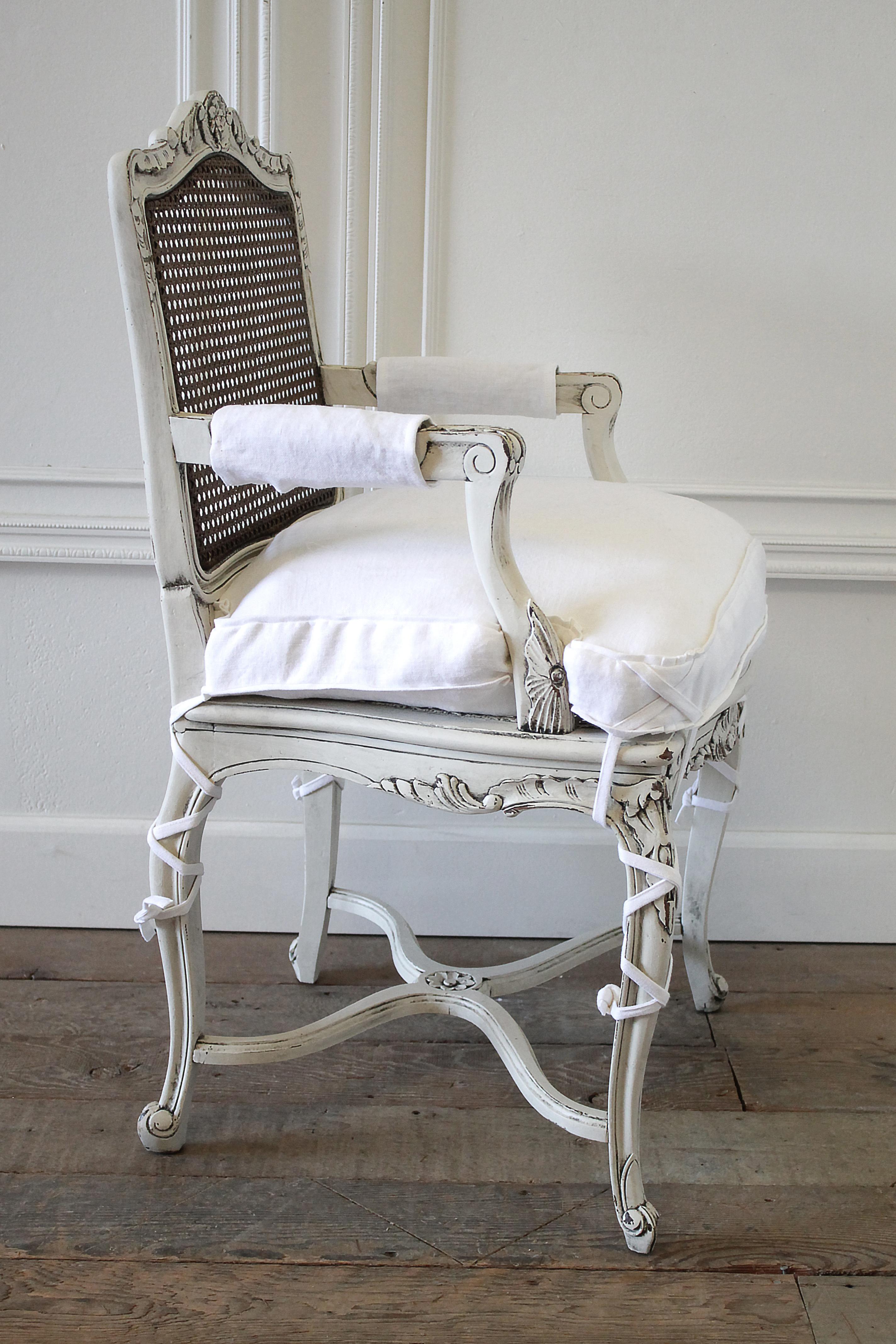 19th century country French cane back chair with linen cushion
Beautiful antique chair painted in oyster white finish light distressed edges, and antique glazed patina, with natural cane back, very solid and sturdy ready for everyday use. We made a