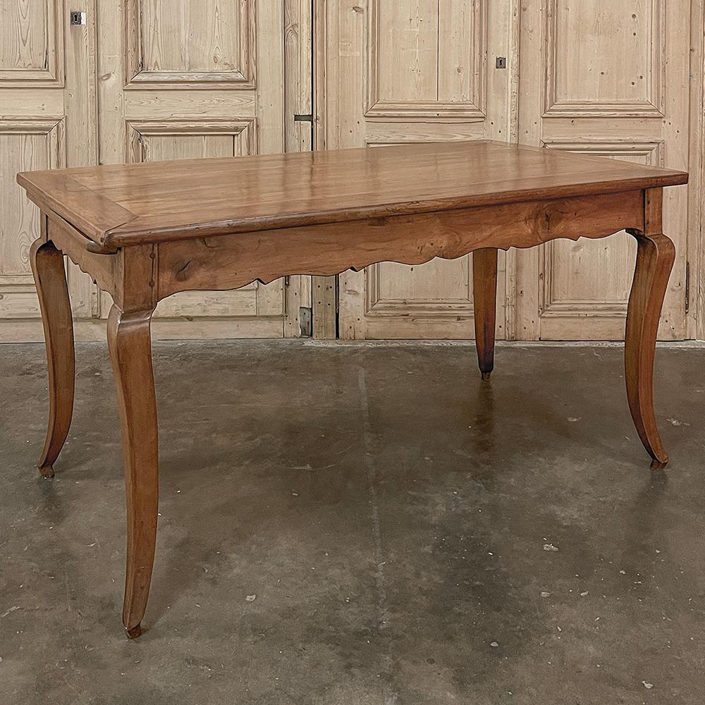 19th Century Country French Cherry Wood Dining Table will make the perfect choice for a cozy, casual dining room or as the ideal breakfast table!  Hand-crafted from solid old-growth cherry wood, it features the natural warmth and richness of the