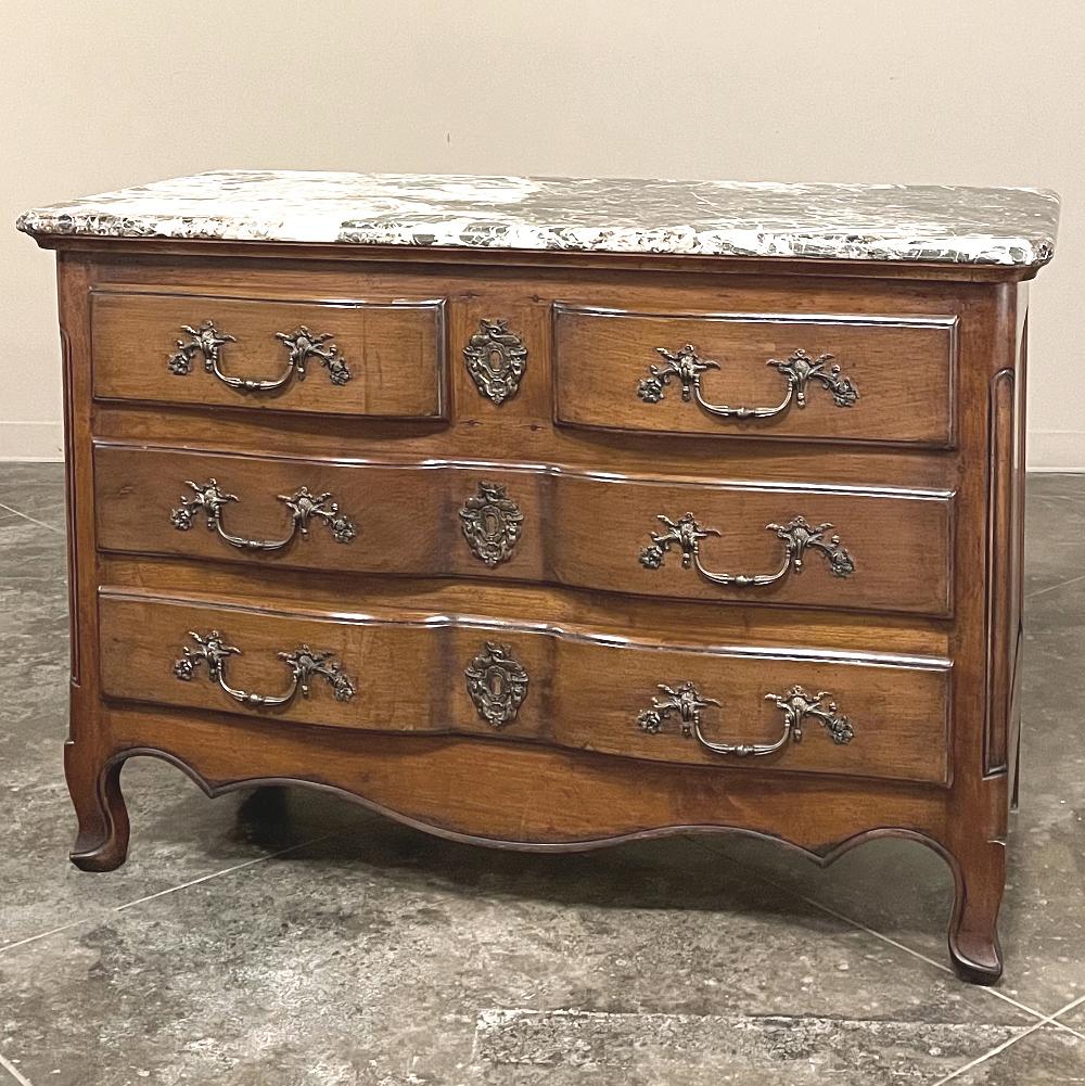 19th century Country French cherrywood marble top commode combines the best of all worlds! Exuding a somewhat rustic look thanks to the natural beauty of the solid aged cherry wood, it features refined embellishments in the form of finely cast