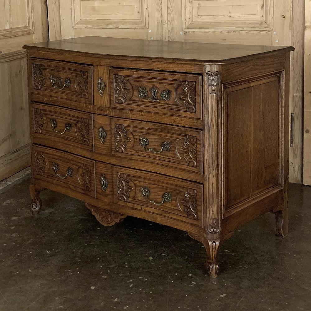 19th century Country French commode is an elegant and refined work, yet with a casual appeal that will work with an enormous variety of styles! Crafted from solid old growth oak it features a subtle bowfront design that creates visual appeal from
