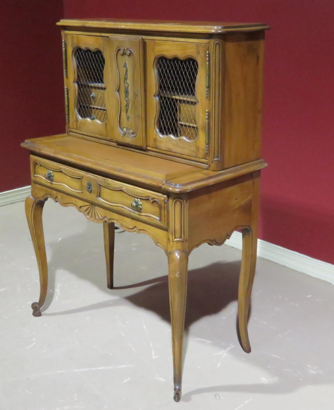 19th century Country French writing desk with two doors containing four drawers over a pull out writing surface and one drawer.