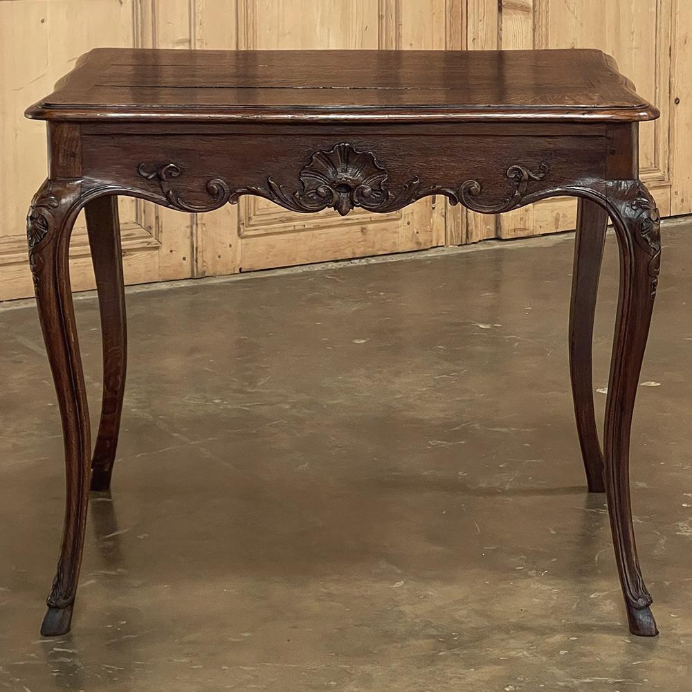 19th Century Country French End Table boasts timeless style and flair, yet exudes a casual charm that will make it versatile for a wide variety of decors! Hand-crafted from solid oak, it features a subtly contoured top with cove and half-bullnose