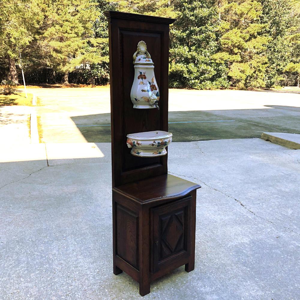 19th century Country French fountain with porcelain reservoir and basin is a charming ode to a bygone era! Back before hot and cold running water, it was desirable for family members and farm hands to have a place to wash up before coming inside for