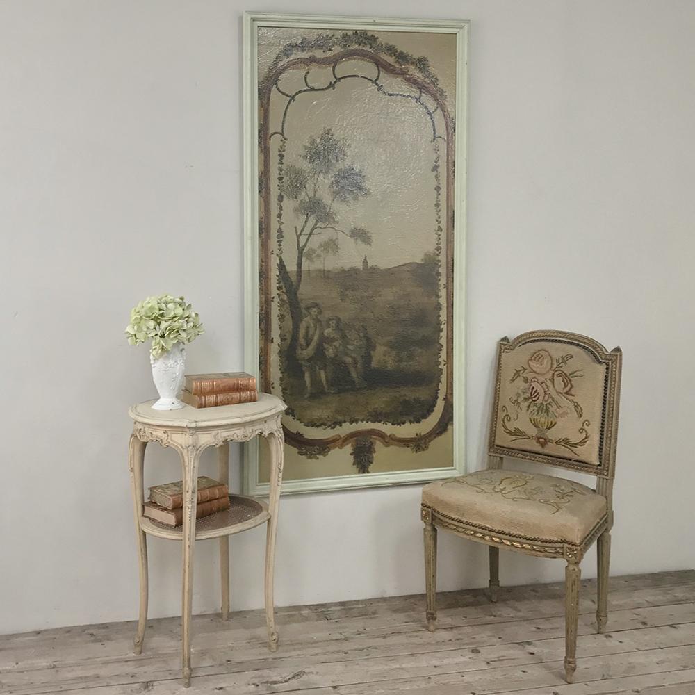 19th century country French framed painted wall panel is the perfect choice when one wants a departure from the typical framed painting or tapestry. Subtle neutral taupe tones create a placid, calming effect, with a beautiful landscape as the