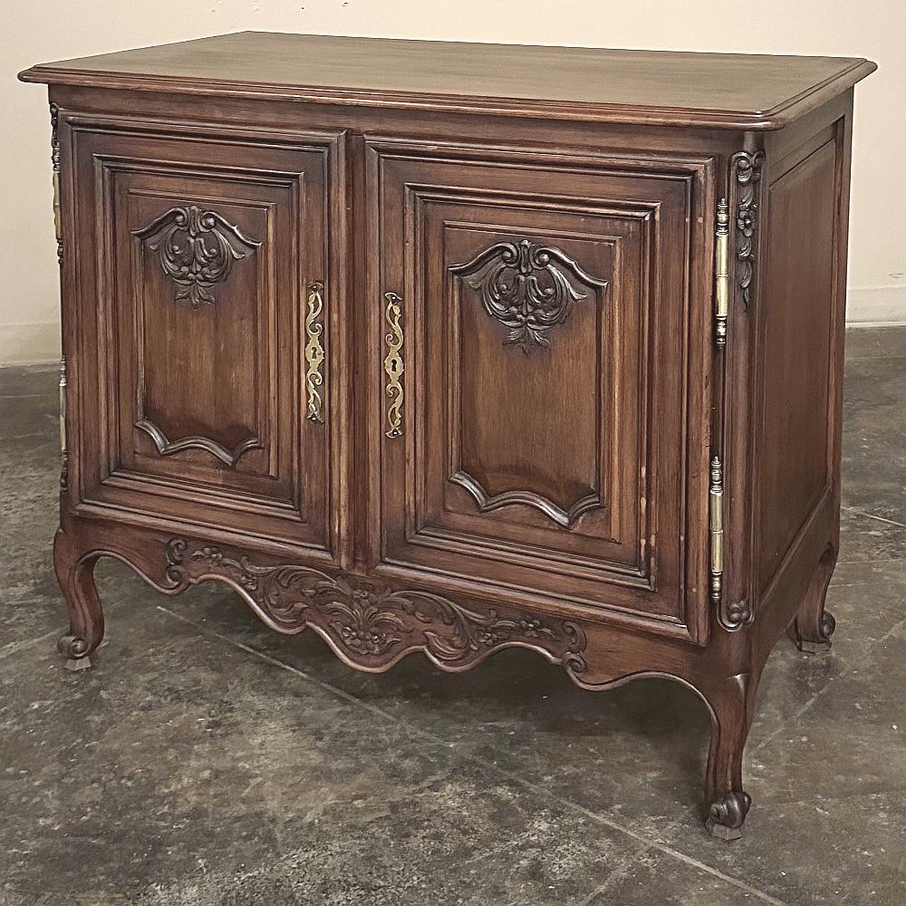 19th Century Country French Fruitwood Credenza is an excellent choice for an efficient floor plan or a cozy nook.  Fine raised panel construction was utilized throughout the piece, even the back, and on the sides which creates a visually pleasing