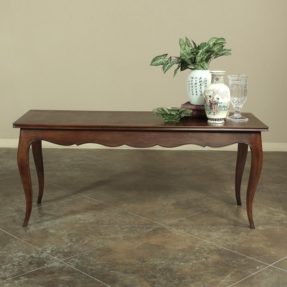 Handcrafted from solid fruitwood by talented rural artisans, this sofa table reflects the essence of simplicity, with a subtly scrolled apron and subtly scrolled cabriole legs combining with the parquet top to produce an understated elegance to any