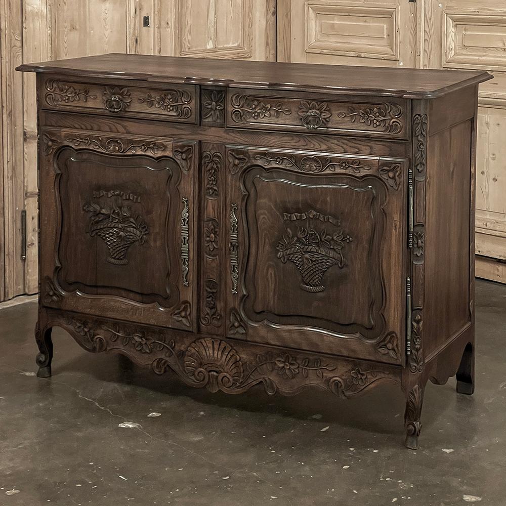 19th Century Country French Louis XVI Buffet is just the right size for a cozy spot, offering lots of display surface and a surprising amount of storage in a relatively diminutive piece.  Hand-crafted from oak and maple woods, it has been given a