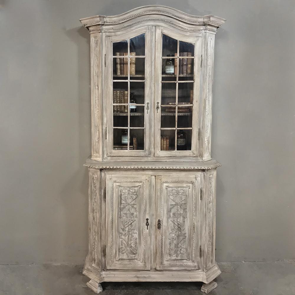19th century country French Louis XVI stripped bookcase ~ vitrine makes the perfect display piece for your library or special collection and family heirlooms! Multi-paned display above under a gracefully arched crown contrasts with the exquisitely