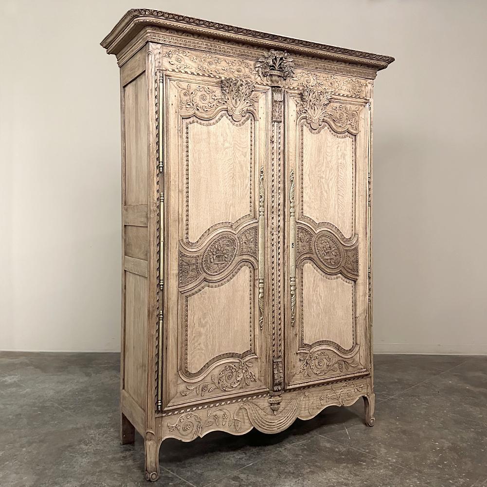 19th Century Country French Normandie Armoire in Stripped Oak is a splendid testament to the incredible talents of the artisans of the storied region in northern France, from which William the Conquerer hailed.  This example was rendered entirely