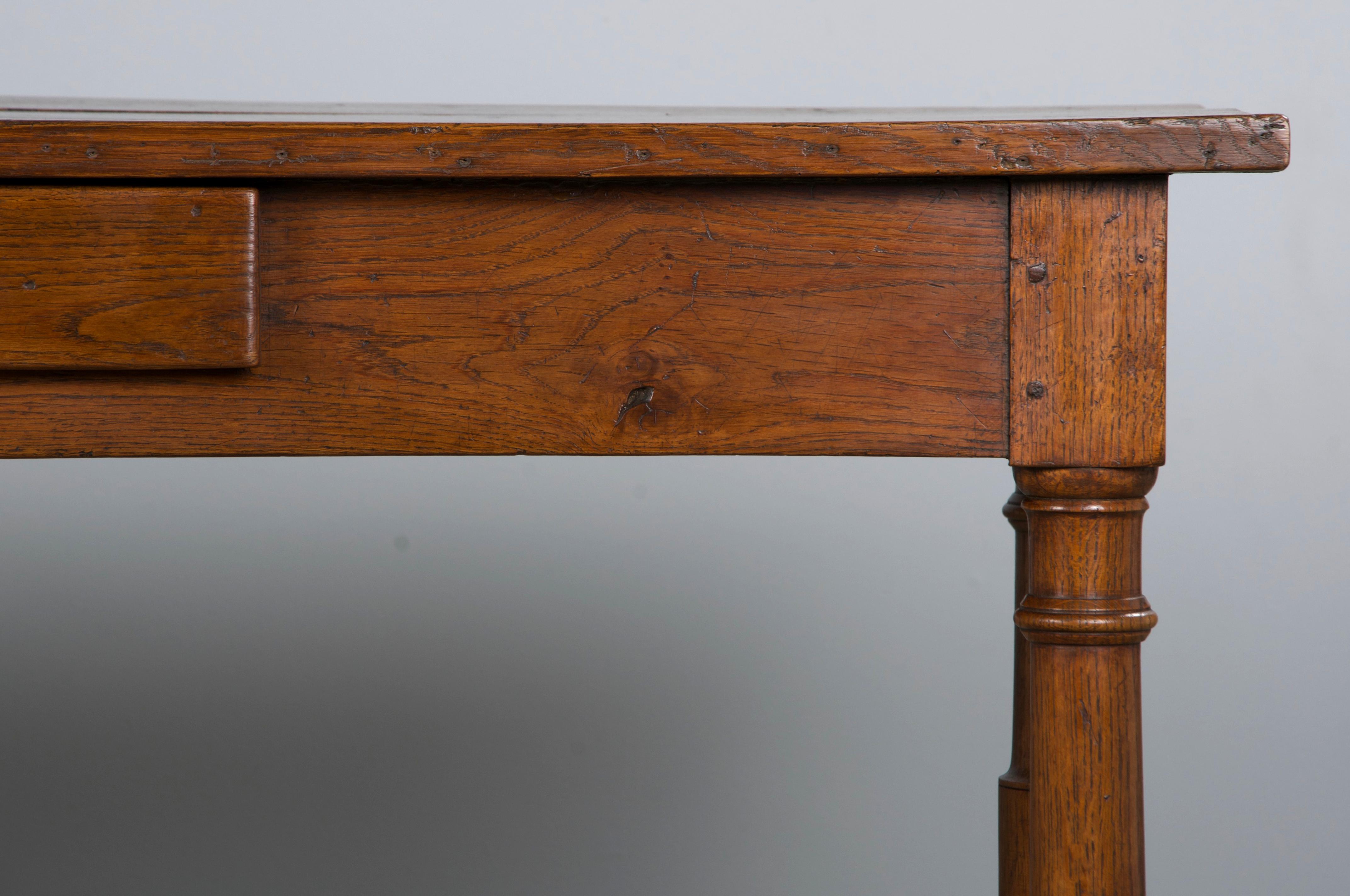 19th-century Country French farmhouse trestle dining table, writing table, or large console sourced from Provence, France. Beautifully hand-crafted from solid oak, it features a 7'9