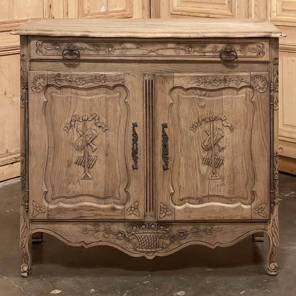 19th Century Country French petite buffet in stripped oak is a whimsical example of rural French artisanry, and of a diminutive size making it ideal for cozy spots, small niches, hallways, or anywhere a minimal footprint is desirable! The contoured