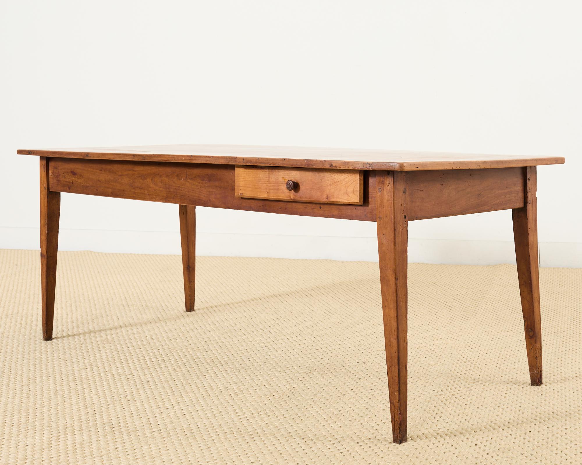 Hand-Crafted 19th Century Country French Provincial Fruitwood Farmhouse Dining Table For Sale