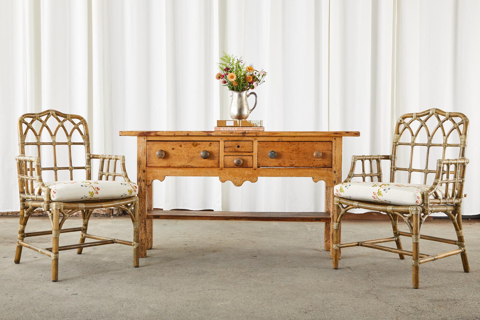 Rustic 19th century country French provincial console table or server crafted from pine. The table features an aged, distressed patina on the pine finish with excellent joinery and craftsmanship. Made with peg joinery having two large storage