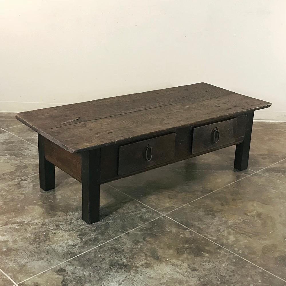 19th century Country French rustic Provincial elmwood coffee table is the perfect answer for the casual decor! Literally designed to last for generations, it features spacious drawers for added convenience. Solid plank top is supported by four large