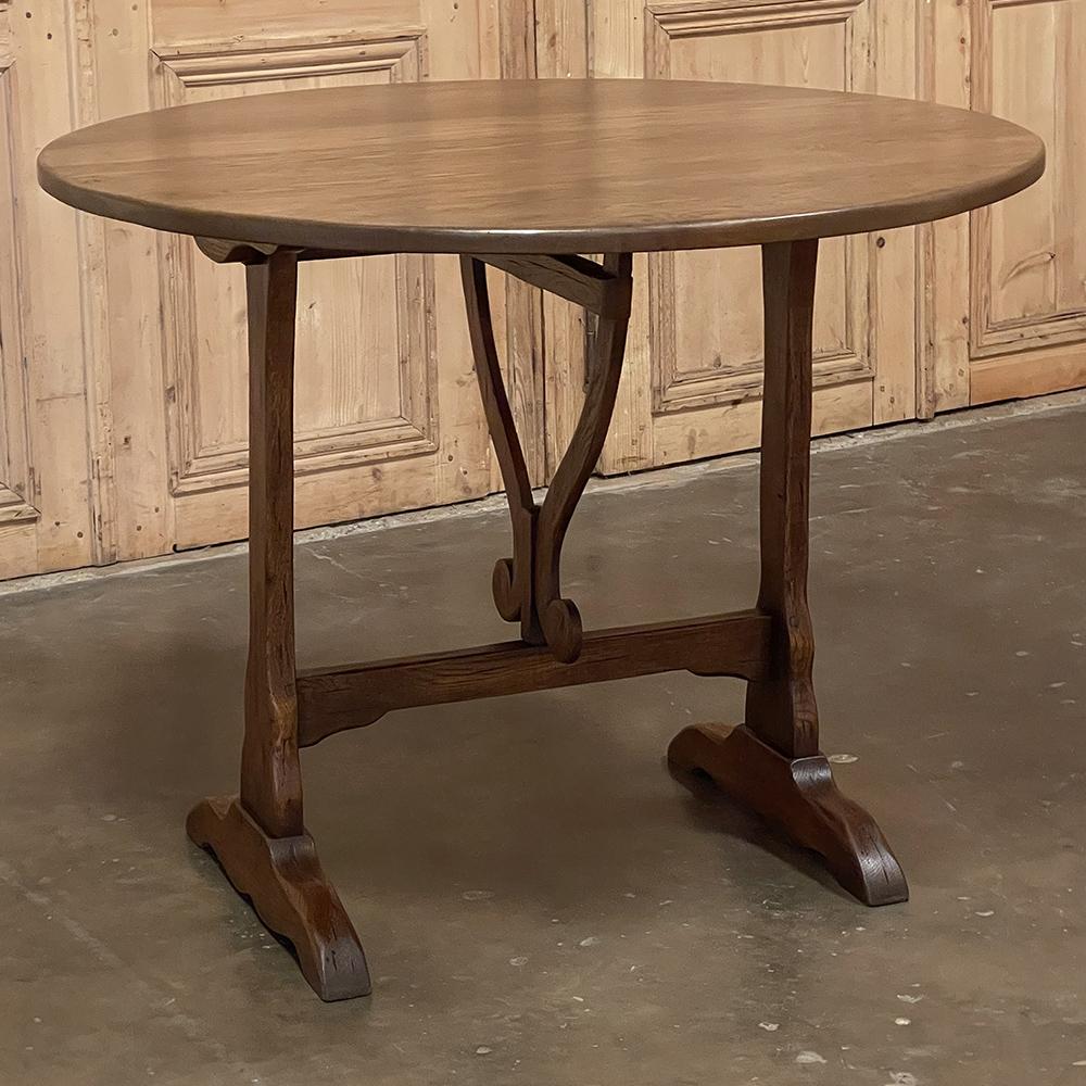 19th Century Country French Tilt-Top wine tasting table is a charming relic from a bygone era, when vintners stored wine in barrels in the cellar, and from time to time needed to sample the barrels to gauge the progress of the wine. Small tables
