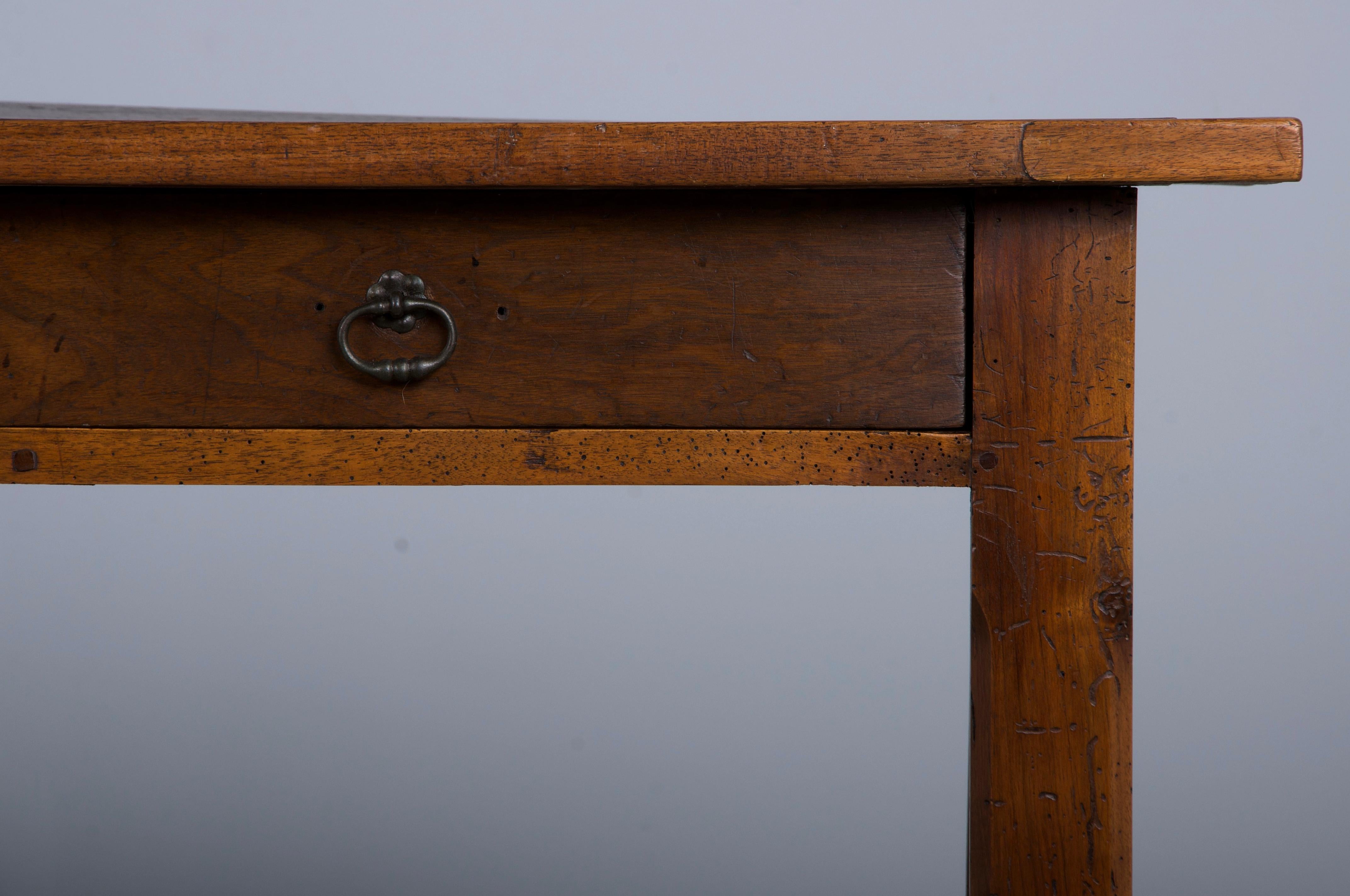 19th-century Country French farmhouse trestle dining table, writing table, or large console sourced from Provence, France. Beautifully hand-crafted from solid walnut, it features a 6'7