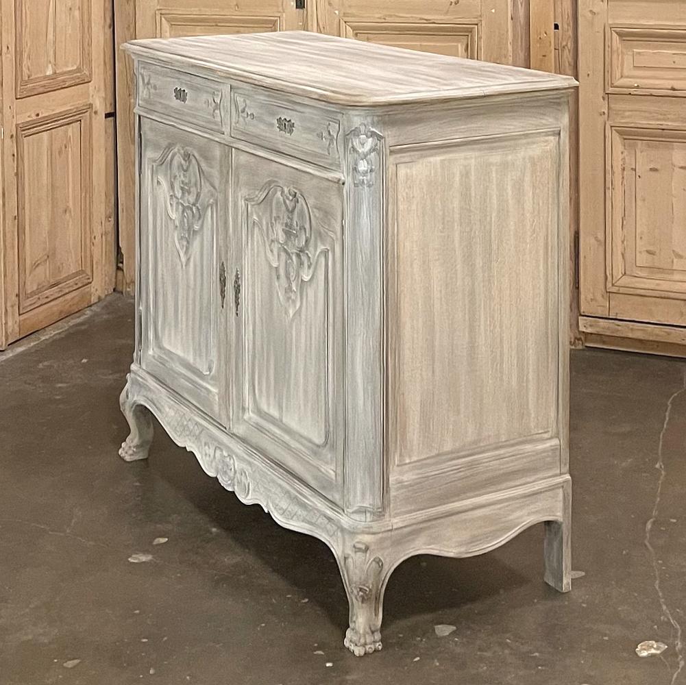 19th century Country French Whitewashed buffet is a splendid example of fine craftsmanship, with tailored, elegant lines following the design cues of the Regence period, influenced by both what we call today the Louis XIV and Louis XV styles.