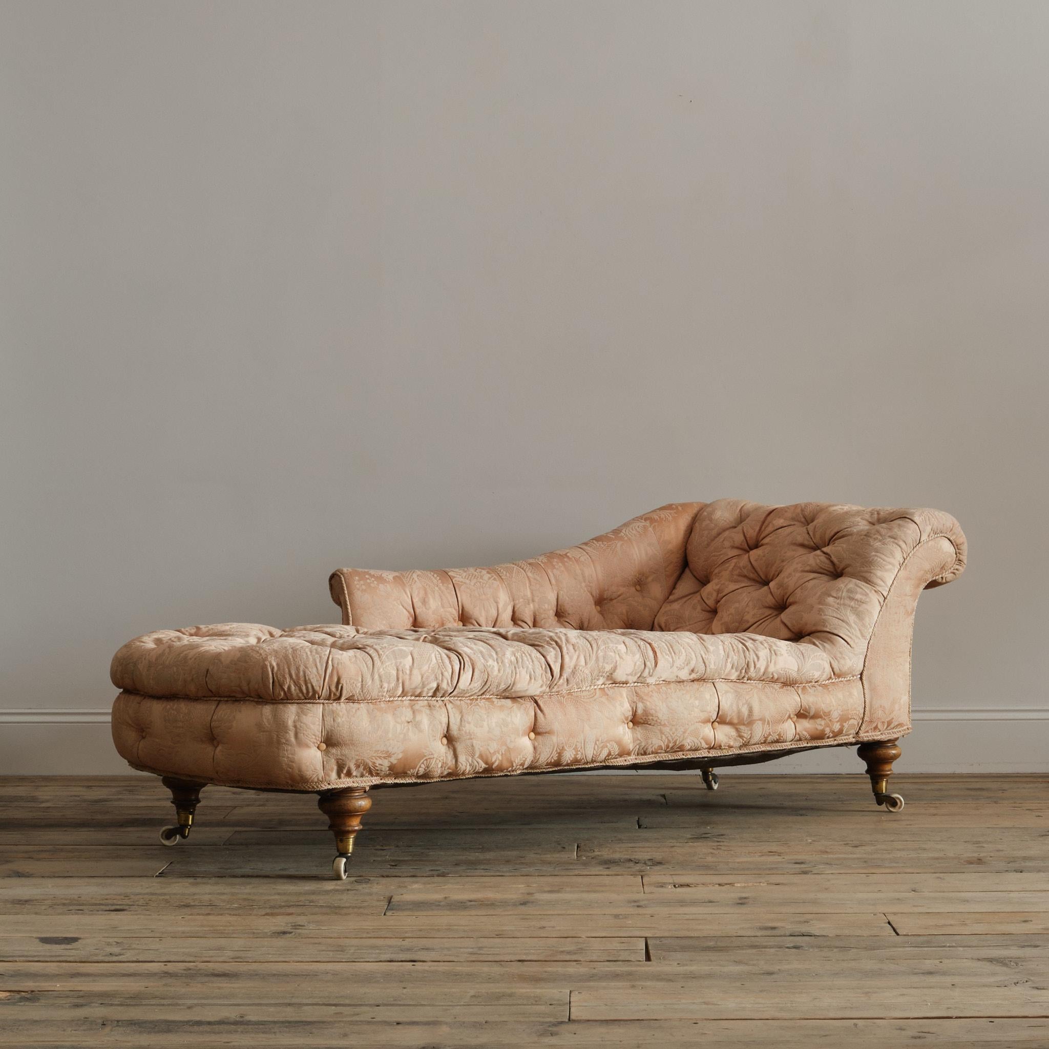 A large 19th century country house Howard style chaise lounge. Raised on 4 thick turned walnut legs and the original Cope & Collinson brass cup casters. English c1860

Structurally in good solid order and for upholstery. 

147cm seat depth 

43cm