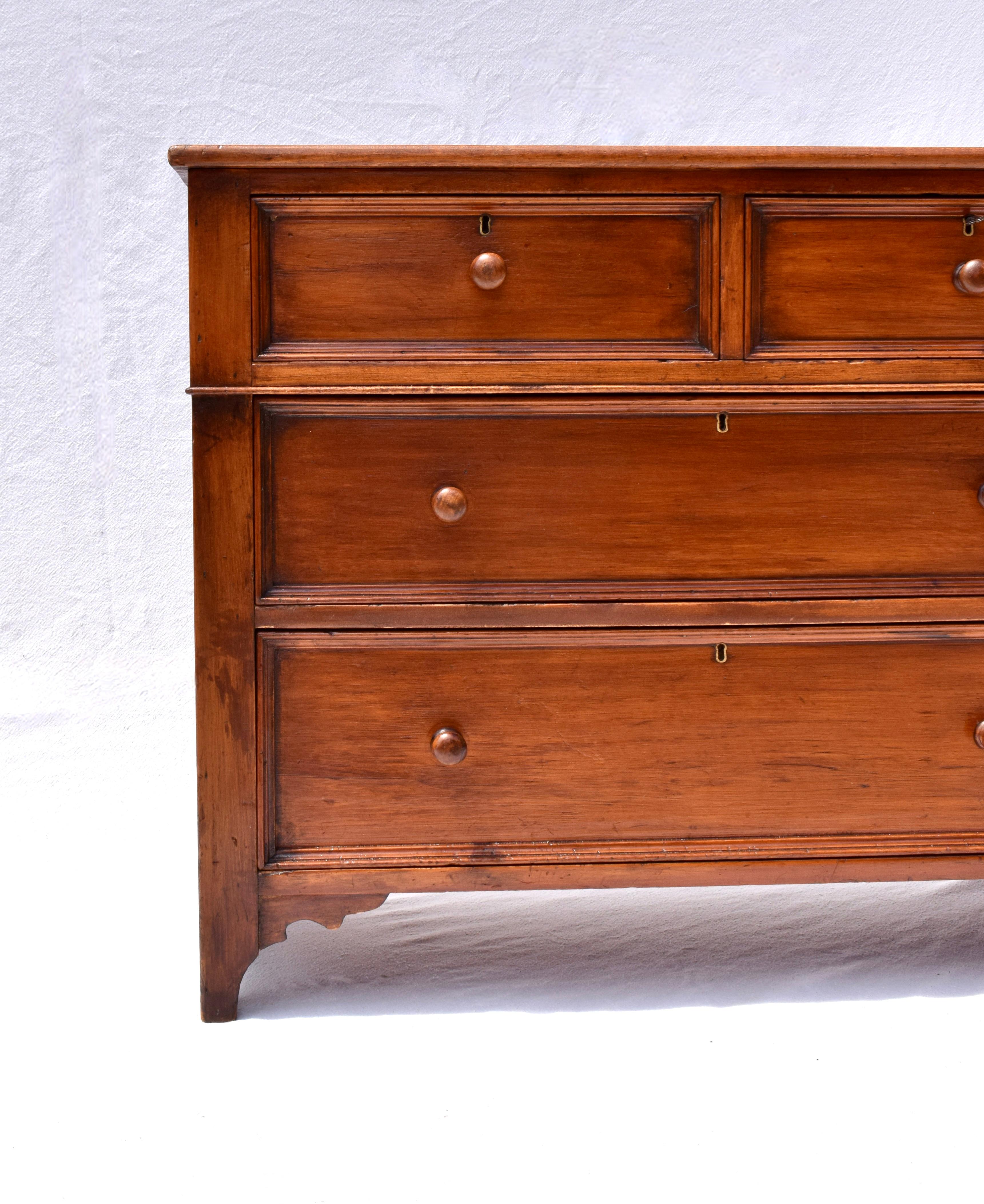 Mid 19th Century Solid Pine chest of drawers featuring a single plank top, four nicely recessed drawers enhanced with thick molding, original locks & key.