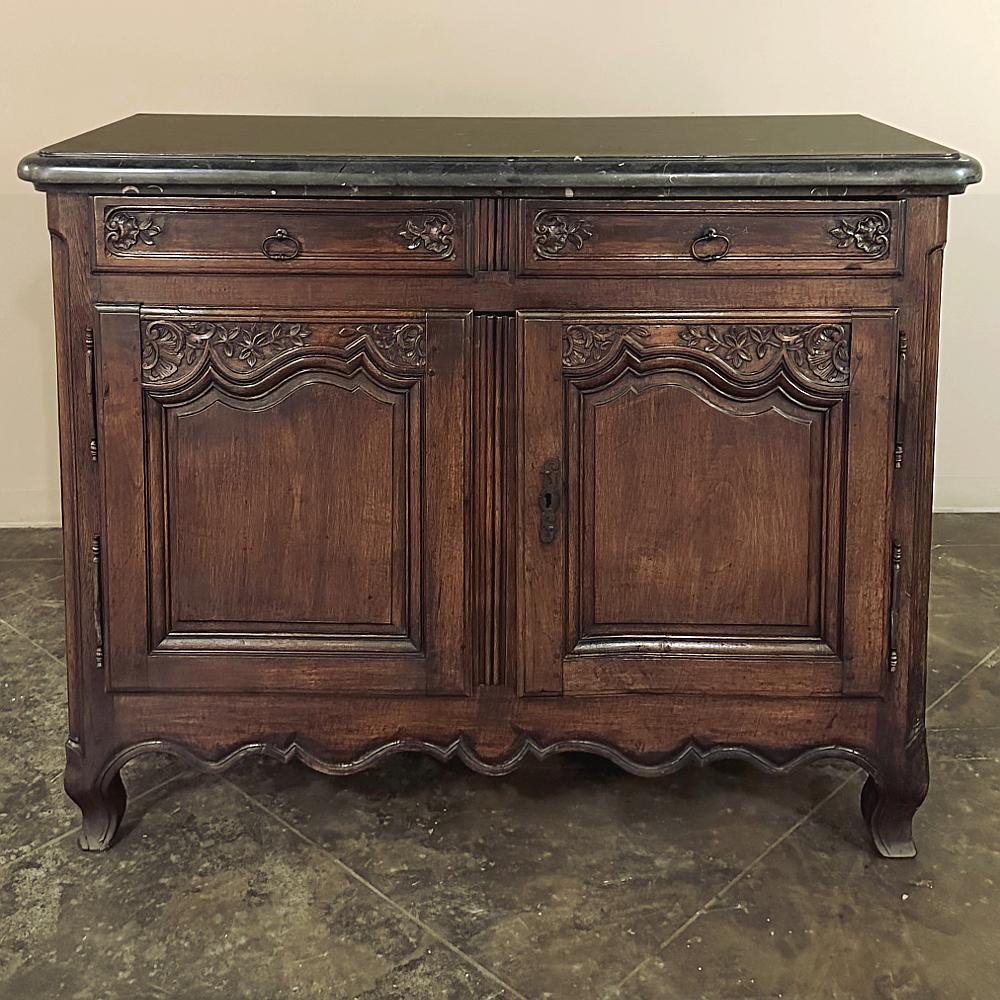 19th century County French walnut buffet with black marble top was meticulously crafted completely by hand during the mid-1700s by obviously talented ebenistes from select indigenous French walnut. This extraordinary example of rural artisanry