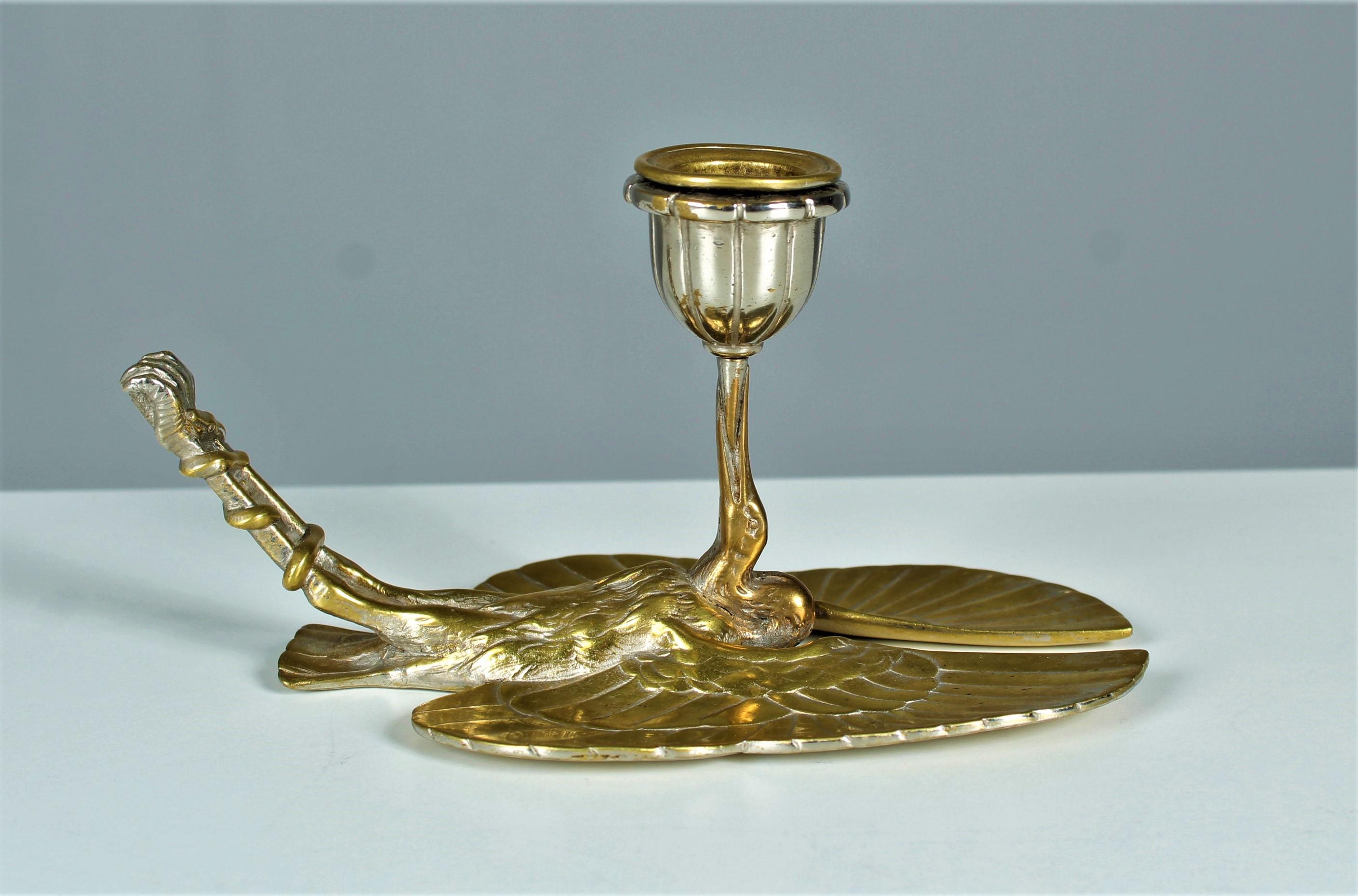 Wonderful unique piece of candleholder.
Beautiful bronze work, nicely chiseled and in a cleaned condition.
Silver plating rubbed.