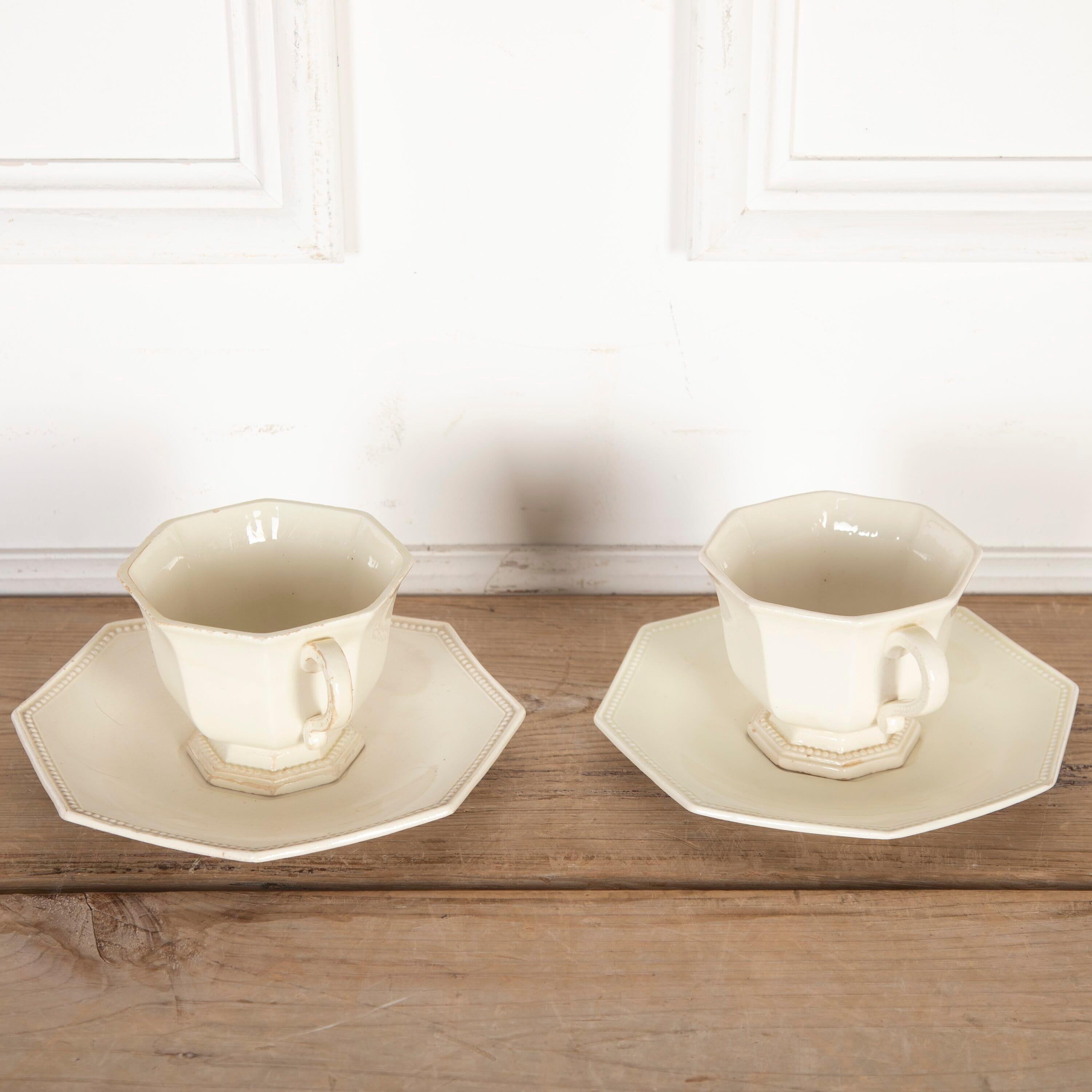 Two French 19th century French creamware chocolate cups and saucers, by Creil Montereau.

 