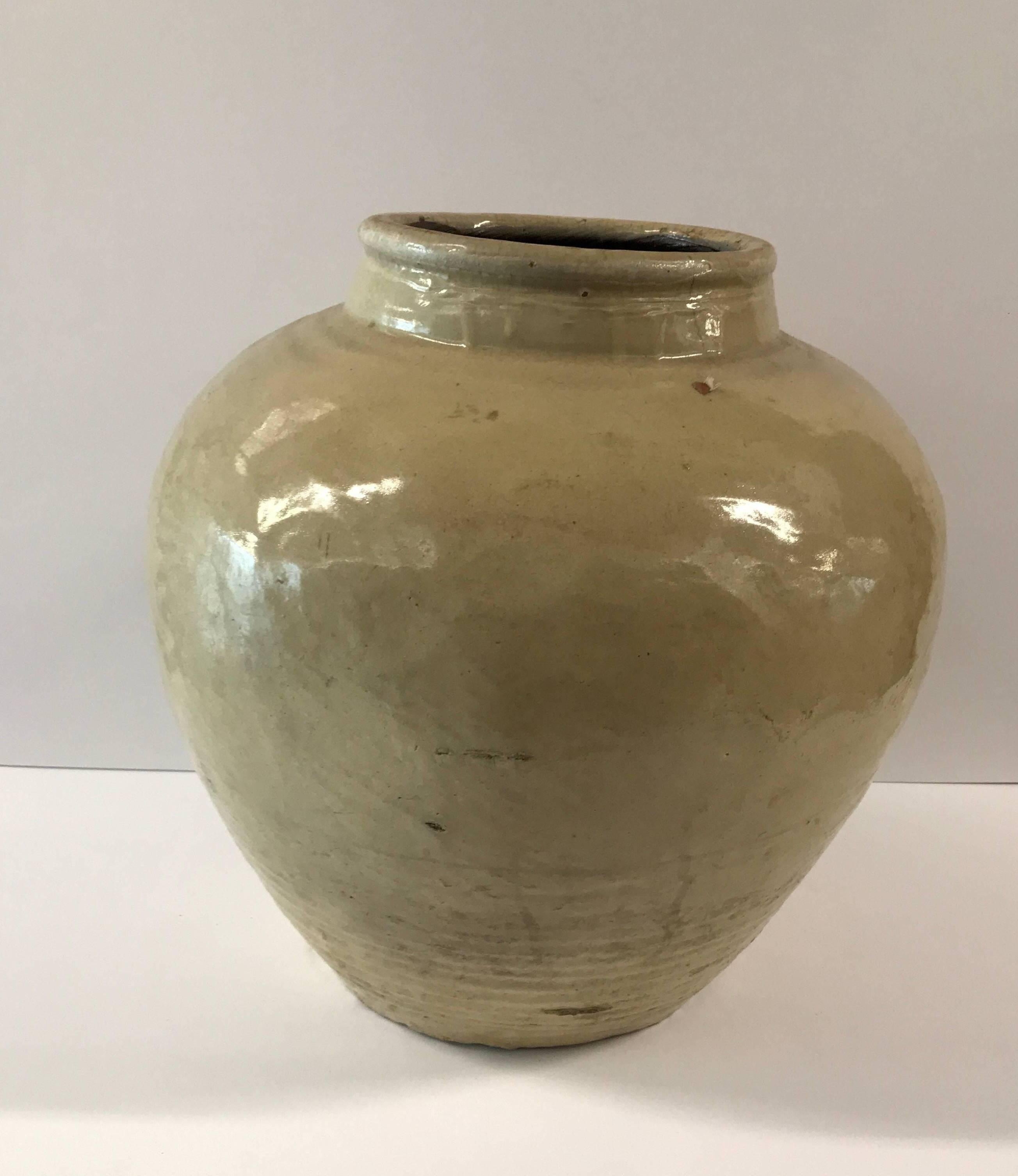 19th century crème or maize colored glazed Chinese pickling jar





Dimensions: 16 in. H x 17 in. diam. with an 8 in. diam. Opening and 9.5 in. diam base.