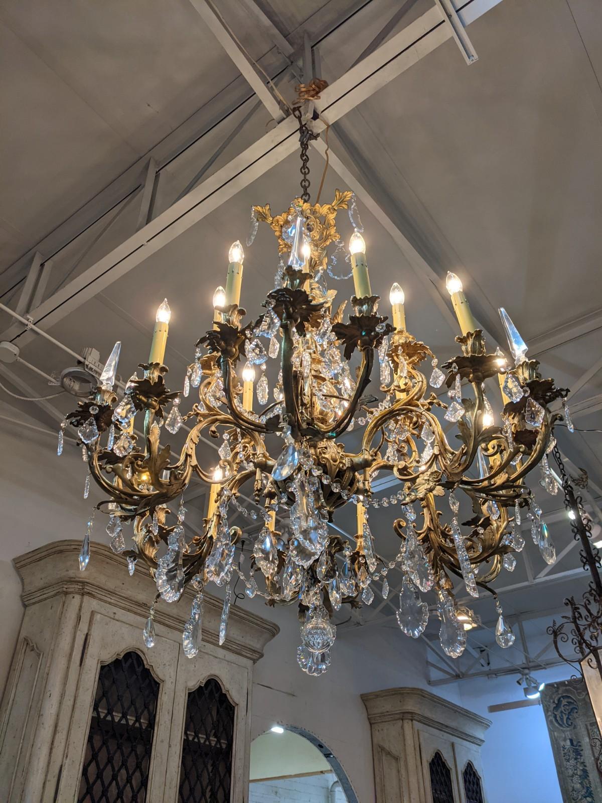 This crystal and bronze chandelier origins from France, circa 1880.

It was originally with gas but it has been transformed with electricity.

The Chandelier has 18 lights (12 the first level and 6 the second level).