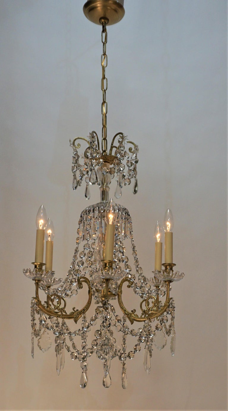 Elegant 19th century chandelier from France with beautiful bronze and crystal, has 6 lights that has been professionally rewired.
Minimum height full installed 34