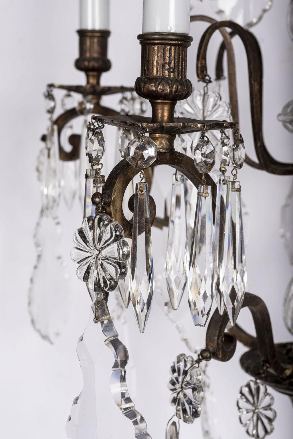 19th century crystal chandelier: Gilt brass frame adorned with high quality original crystal prisms attributed to Baccarat. Newly wired using all UL listed parts for use within the USA. Includes chain and canopy (listed height does not include