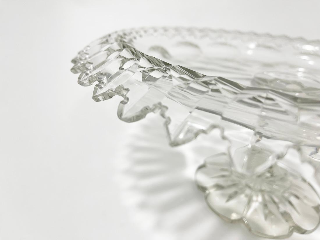 19th century crystal footed turnover bowl

A crystal cut turnover bowl with a castle cut pattern on the edges. A beautiful bowl, raised on a flower-shaped foot with a star crystal cut in the bottom. 
The measurement is 14 cm high and 35 cm