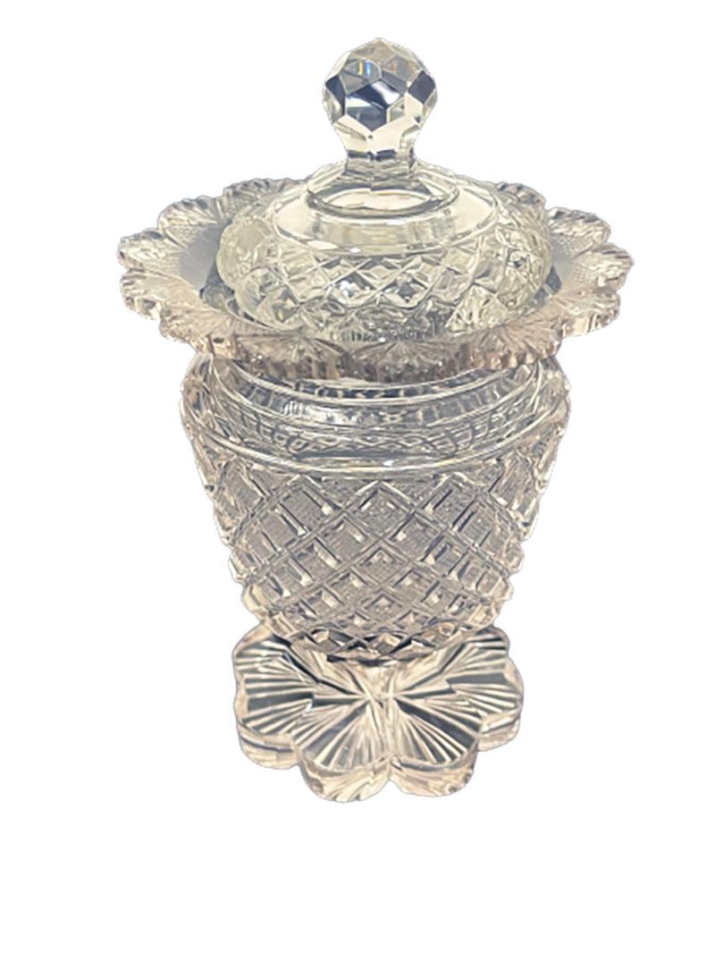 19th century crystal mustard pot

2 different mustard pots with lids. Crystal cut with pineapple and fan motif raised on flower-shaped base. Officially it is called a mustard pot, but also very nice to use the fantasy on the table for serving