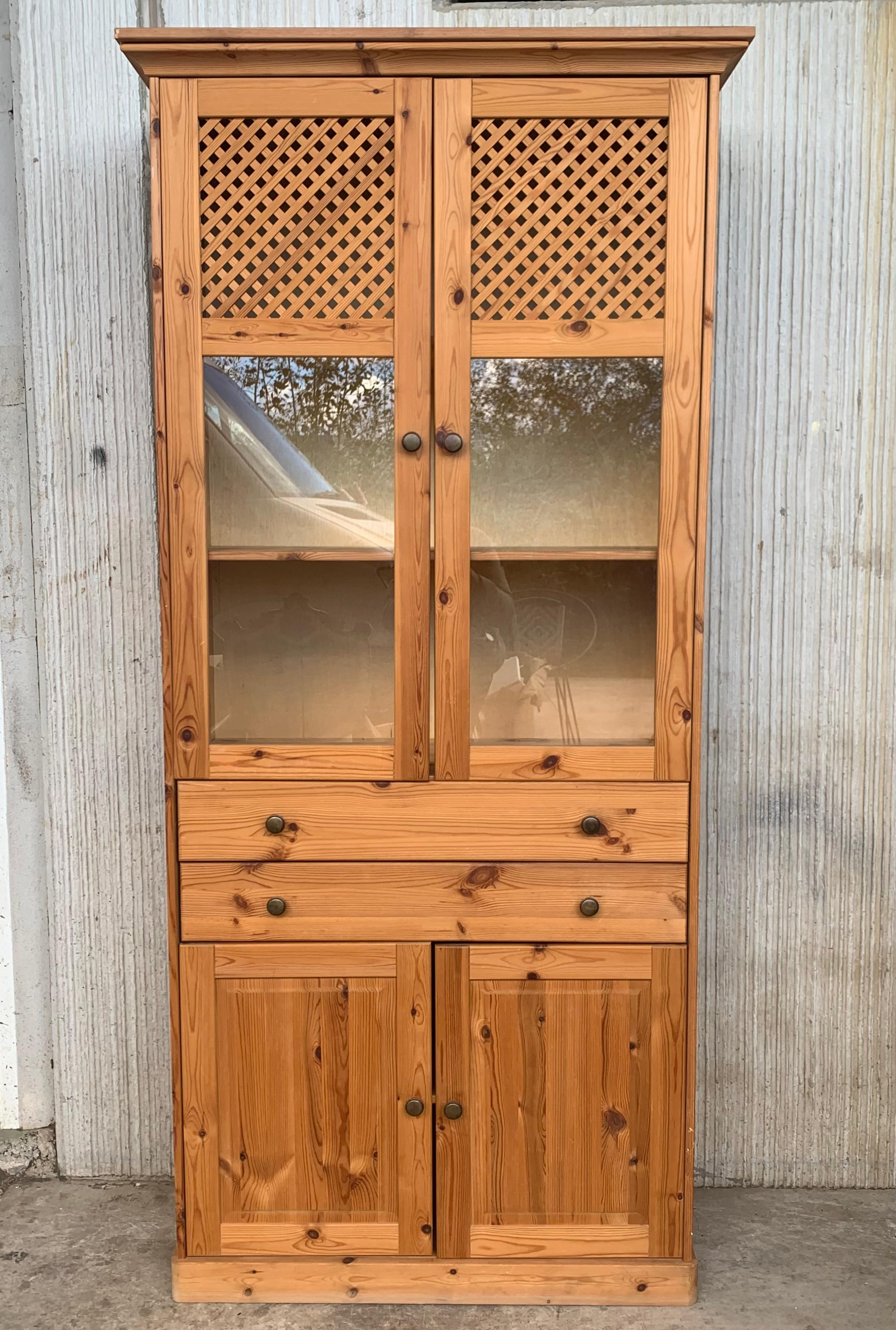 Grand 19th century Spanish armario or wardrobe armoire constructed from walnut. Features a coffered case fronted by two doors. This massive cabinet made in Spain features beautiful walnut grain and showcases the amazing craftsmanship. There is a