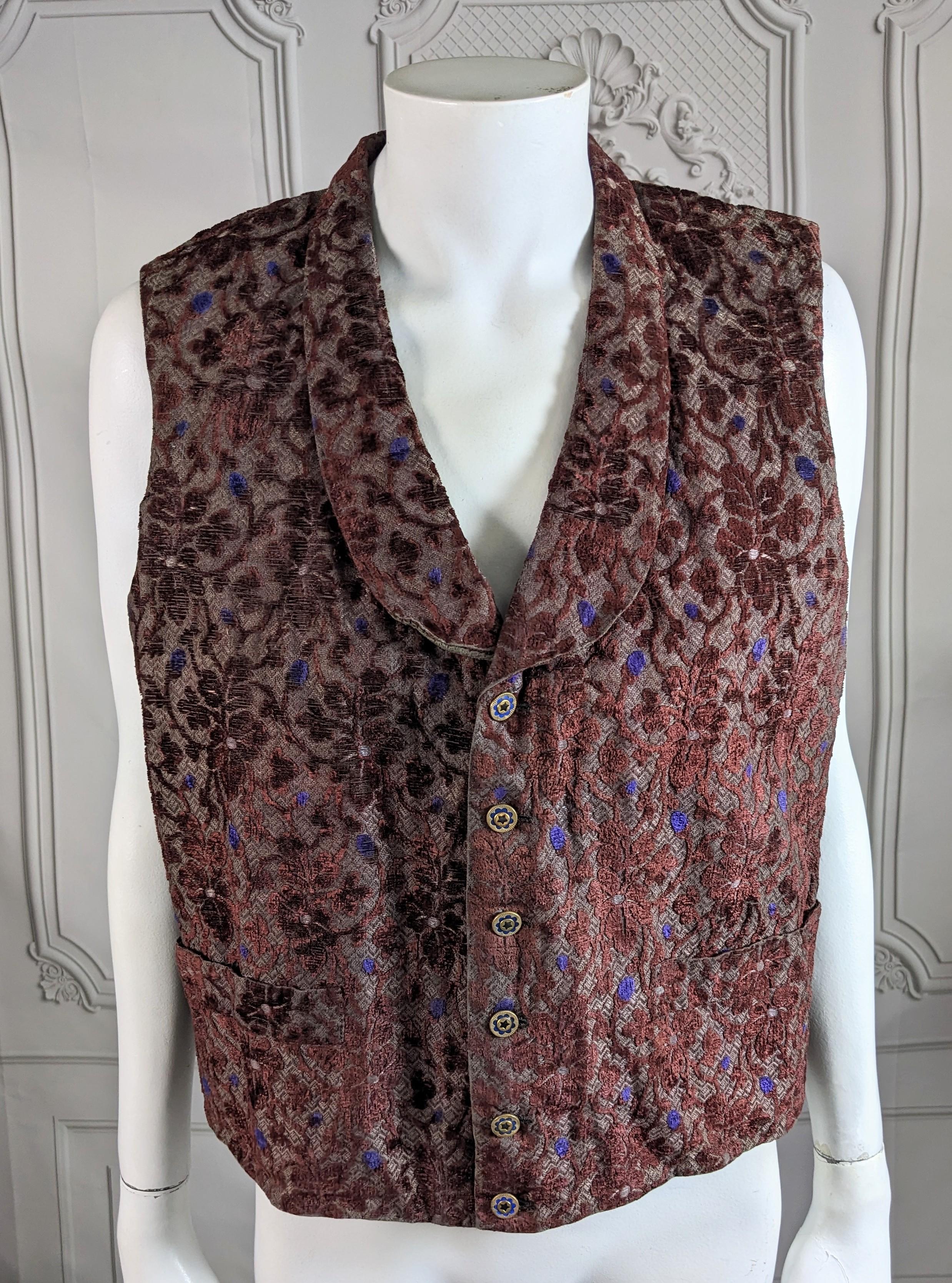 Elegant 19th Century Cut Velvet Brocade Mens Vest circa 1860. Lovely cut velvet textile in deep wine floral with purple blue buds. Enamel buttons with matching blue tones. Lined in cotton flannel and backed in cotton twill. Shawl collar with 2